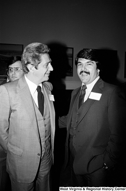 Photograph of two unidentified people at an unidentified event