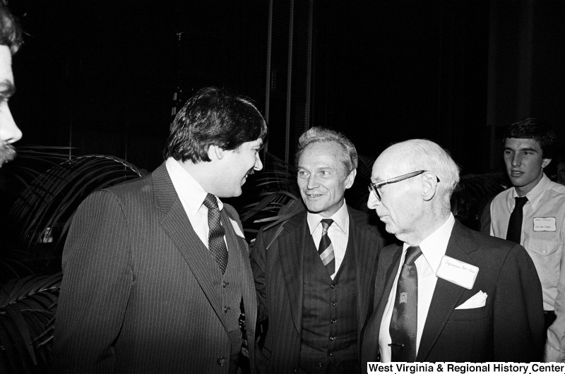 Photograph of Congressman Melvin Price (IL) and other unidentified men at an event