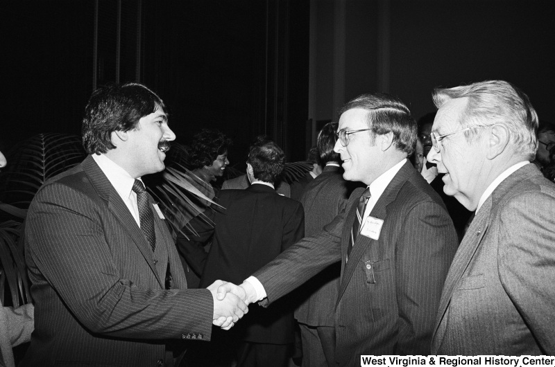 Photograph of Congressman Byron Dorgan (ND), Richard Trumka, and an unidentified person