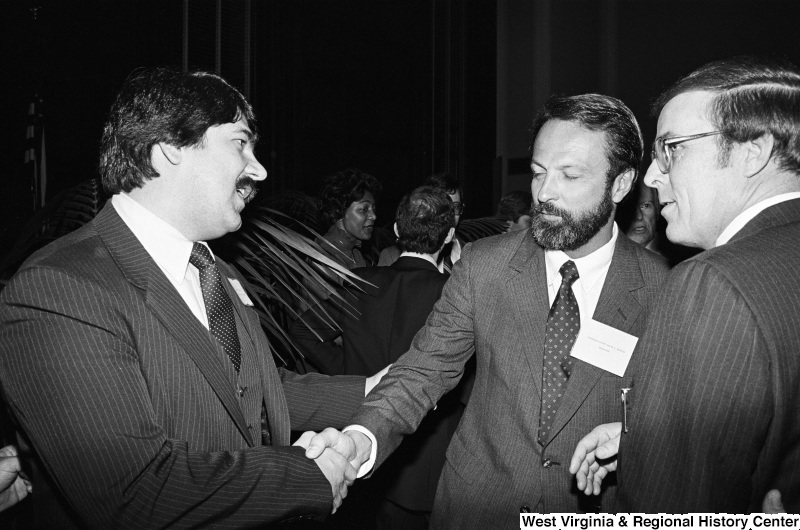 Photograph of Congressman David Bonior (MI), Richard Trumka, and an unidentified person