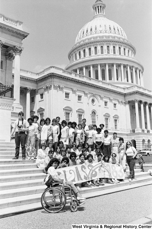 Photograph of unidentified school group holding a "Class of 1983" sign on the steps of the Capitol Building