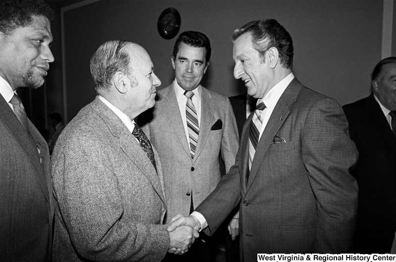 Photograph of Congressmen Frank Annunzio (IL), Douglas Applegate (OH), and Mickey Leland (TX) with actor Danny Thomas