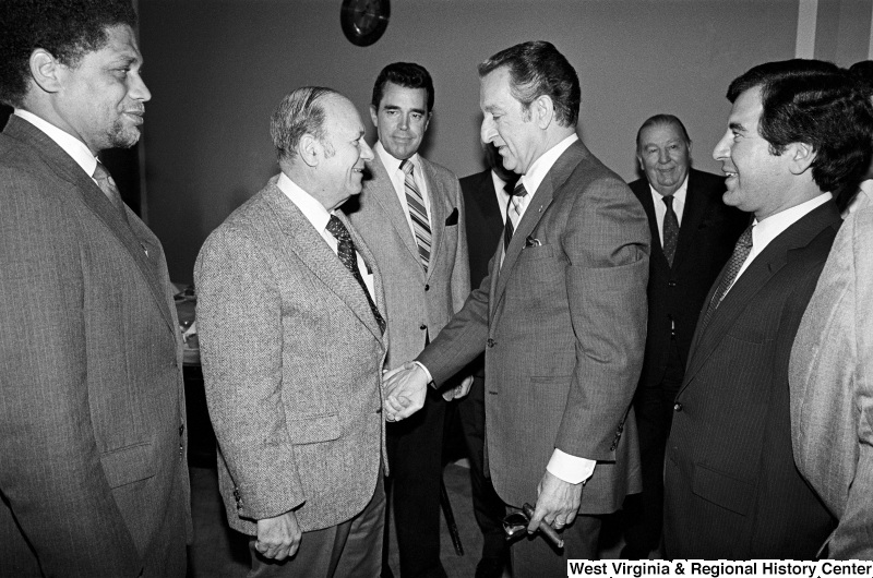 Photograph of Congressmen Mickey Leland (TX), Frank Annunzio (IL), Douglas Applegate (OH), and Nick Rahall (WV) with actor Danny Thomas