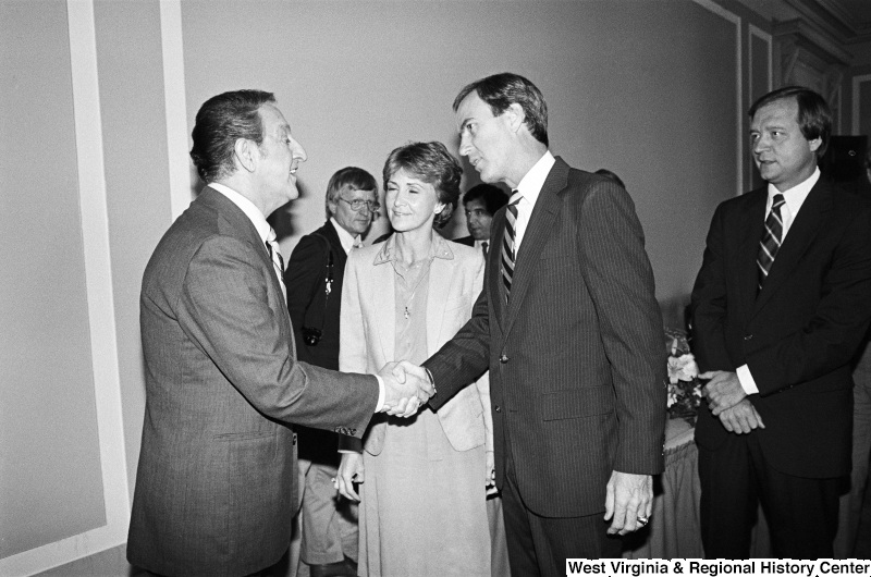 Photograph of a group of unidentified congressmen/women with actor Danny Thomas