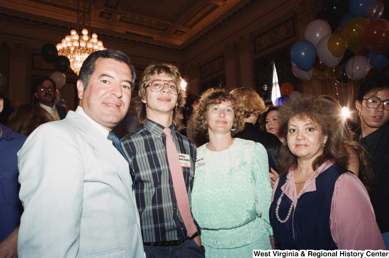 Photograph of Congressman Nick Rahall with three unidentified people at an unidentified event