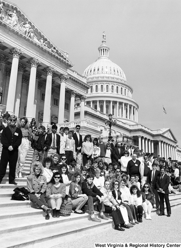 Photograph of Congressman Nick Rahall with a group of unidentified people on the steps of the Capitol