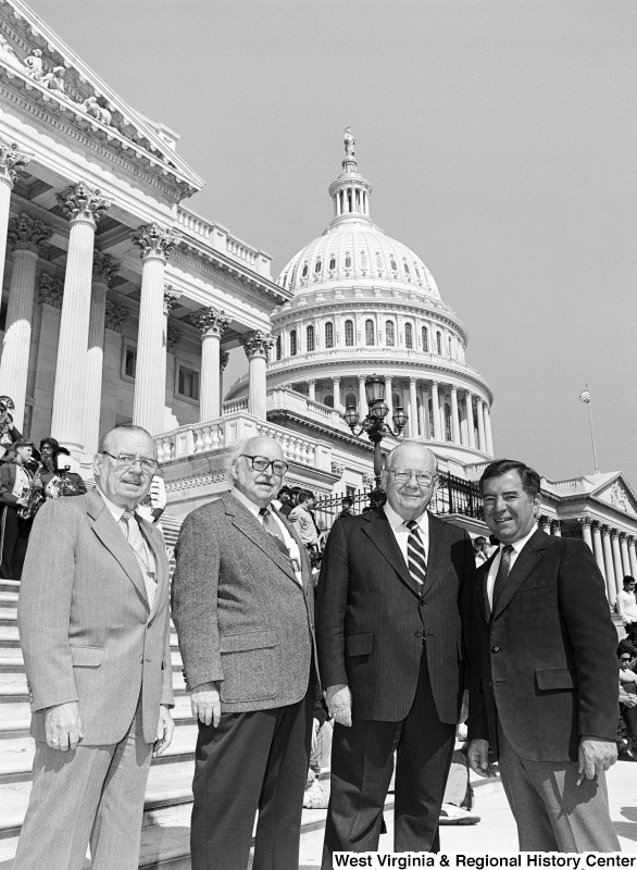 Photograph of Congressman Nick Rahall with three unidentified men on the steps of the Capitol