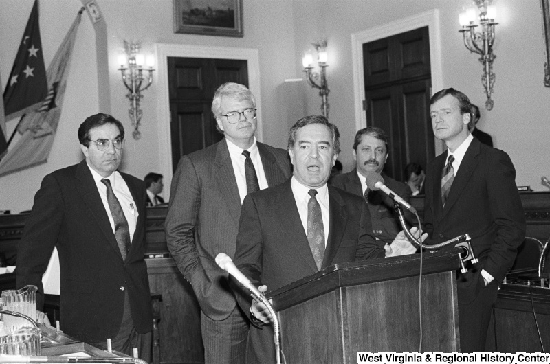 Photograph of Congressmen Nick Rahall, Sam Gejdenson, George Miller, Bruce, Vento, and Peter Kostmayer speaking at an event