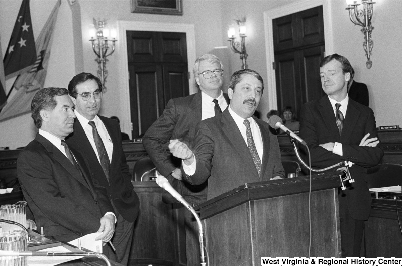 Photograph of Congressmen Nick Rahall, George Miller, Sam Gejdenson, Peter Kostmayer, and Bruce Vento speaking at an event