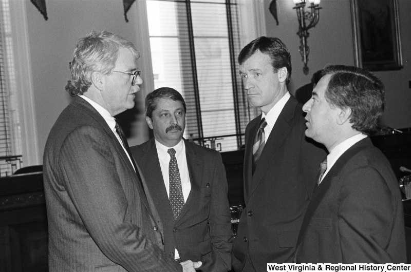 Photograph of Congressmen Nick Rahall, Sam Gejdenson, George Miller, and Peter Kostmayer at an event