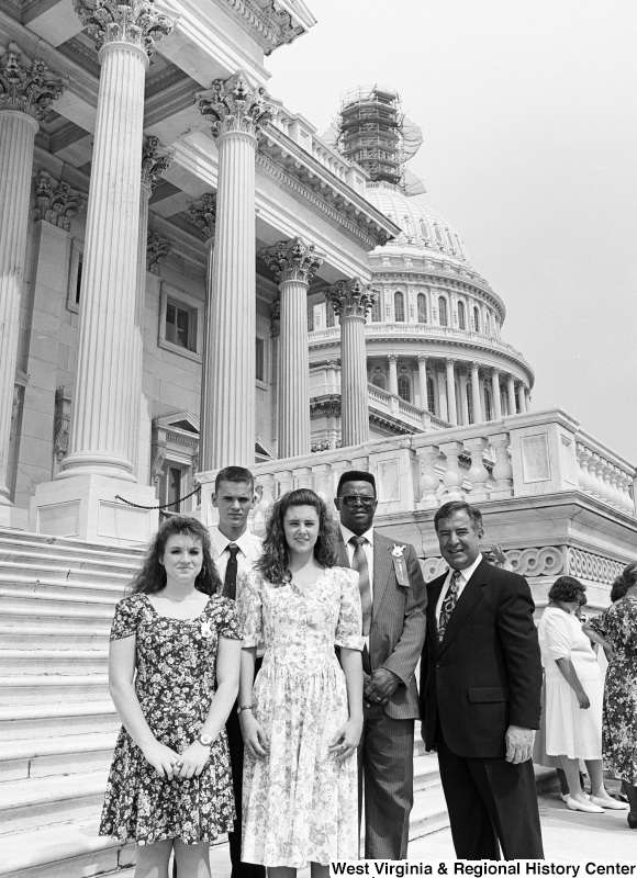 Photograph of Congressman Nick Rahall with four unidentified people