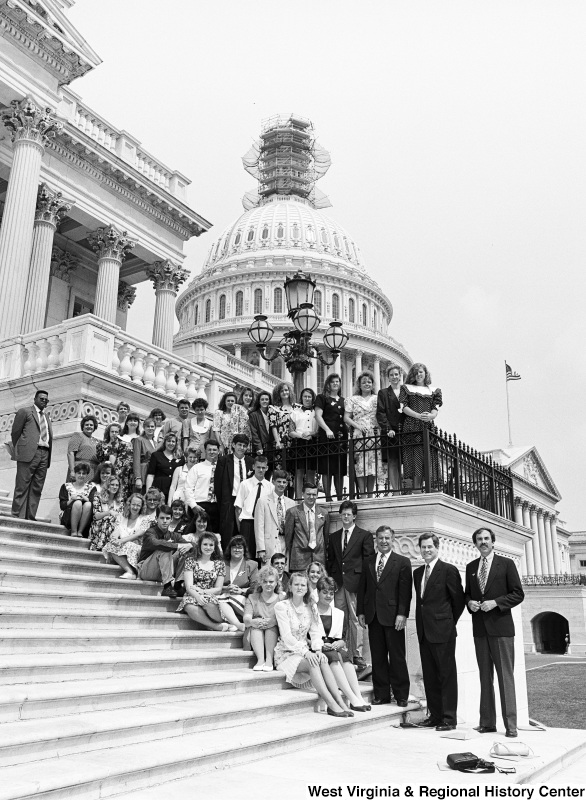Photograph of Congressman Nick Rahall with a group of unidentified people outside of the Capitol