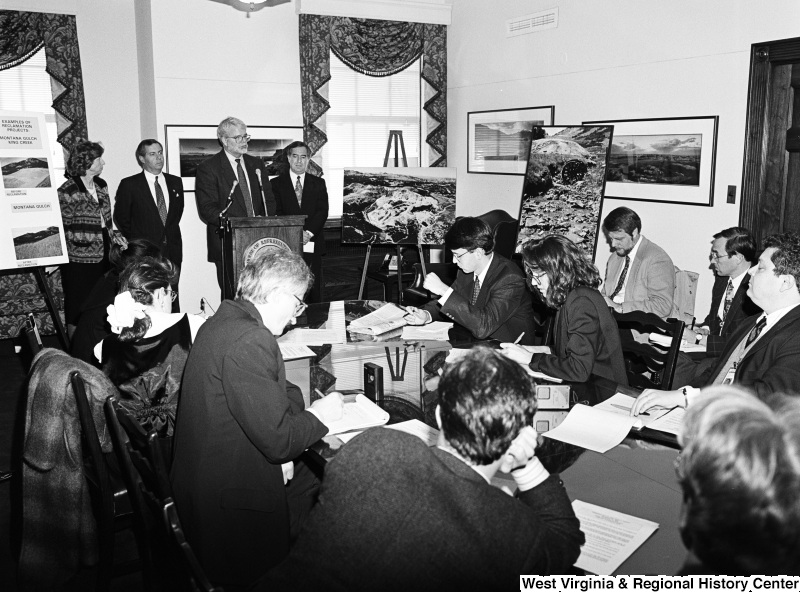 Photograph of Congressmen Nick Rahall and George Miller speaking at a press conference