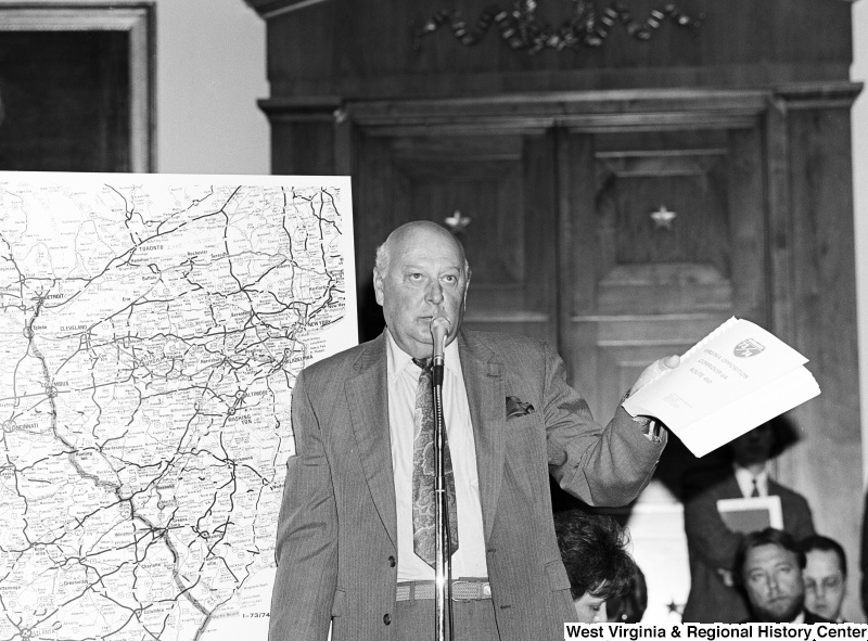 Photograph of an unidentified representative speaking on the Virginia opposition to Corridor 6A, Route 460