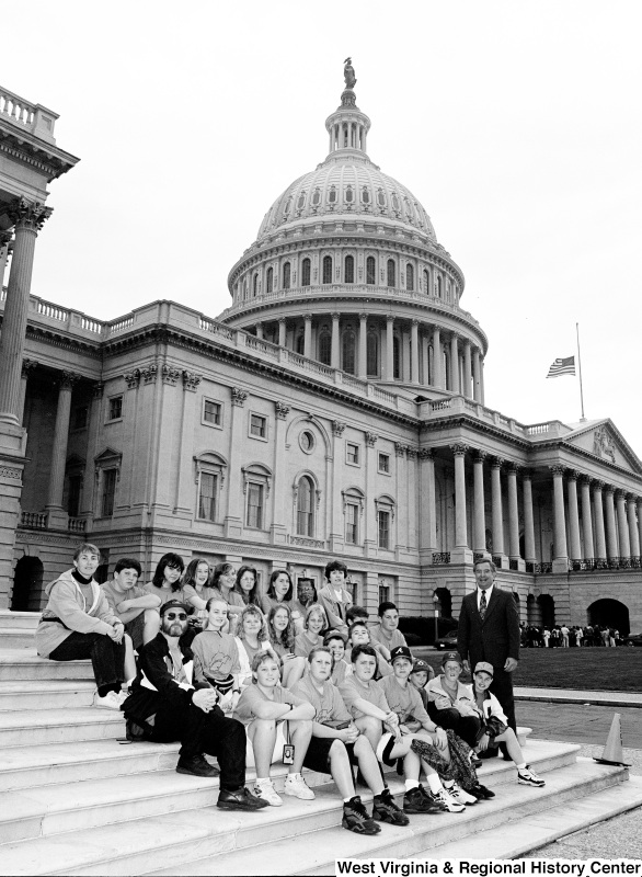 Photograph of Congressman Nick Rahall outside of the Capitol Building with an unidentified school group