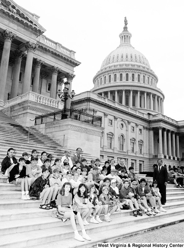 Photograph of Congressman Nick Rahall with an unidentified school group at the Capitol Building