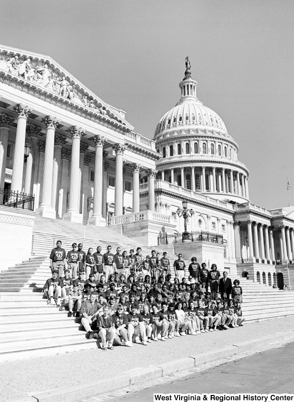 Photograph of Congressman Nick Rahall and a group of unidentified students outside of the Capitol