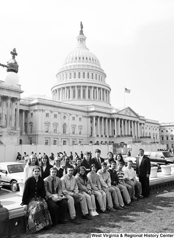 Photograph of an unidentified group of visitors and Congressman Nick Rahall