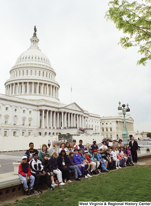 Photograph of Congressman Nick Rahall and an unidentified school group outside of the Capitol Building