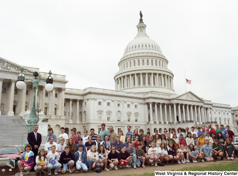 Photograph of Congressman Nick Rahall posing with a group of unidentified students at the Capitol Building