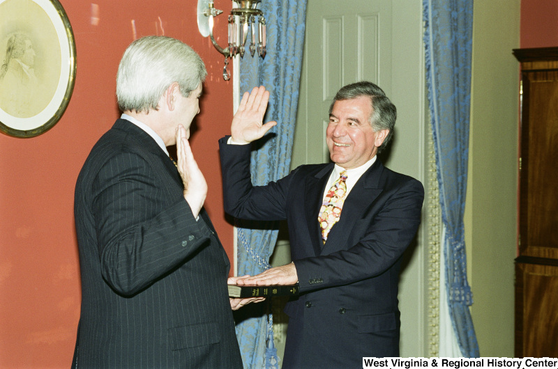 Photograph of Congressman Nick Rahall and Newt Gingrich at a swearing-in ceremony