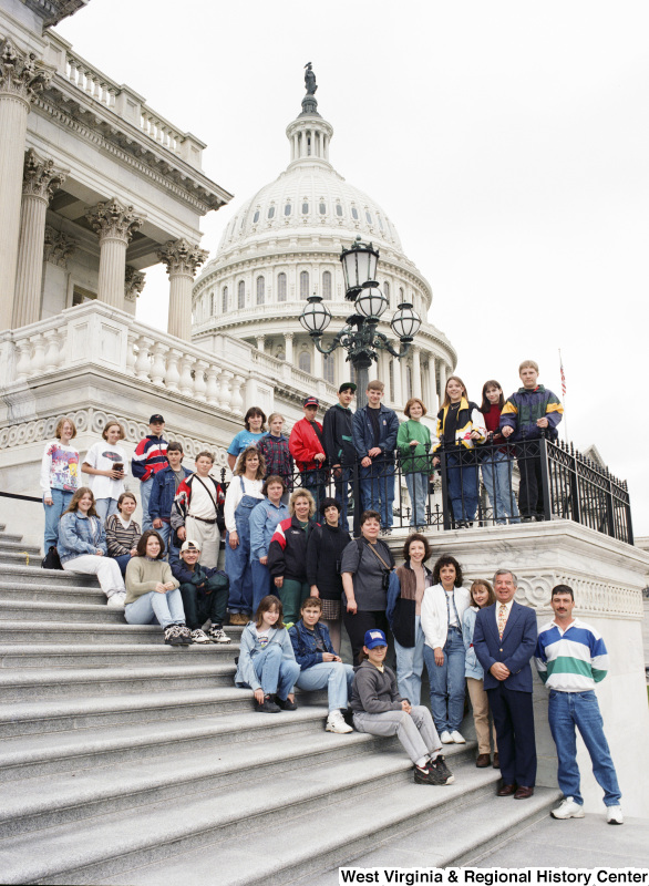 Photograph of Congressman Nick Rahall posing at the Capitol with a group of unidentified people