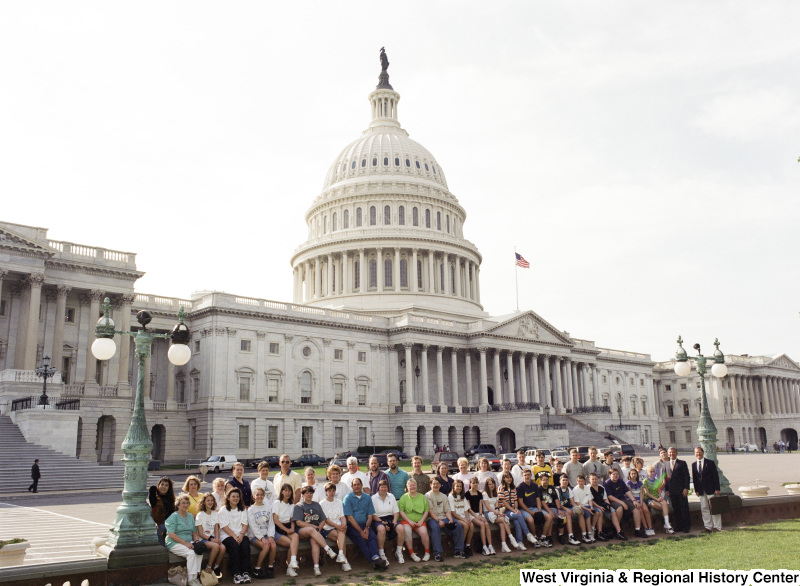 Photograph of Congressman Nick Rahall with an unidentified group of people outside of the Capitol Building