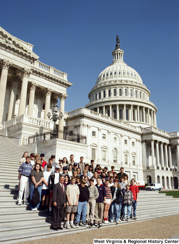 Photograph of Congressman Nick J. Rahall posing with a group of unidentified students at the Capitol