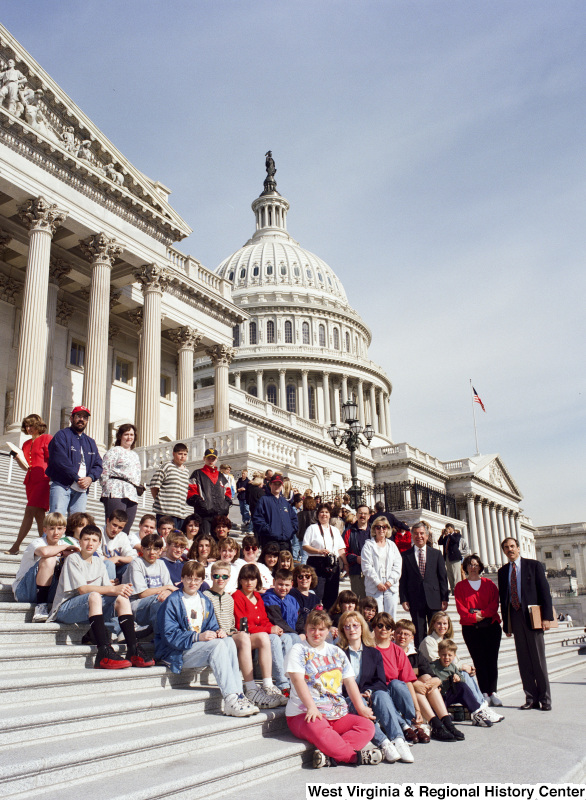 Photograph of Congressman Nick J. Rahall with an unidentified school group outside of the Capitol Building