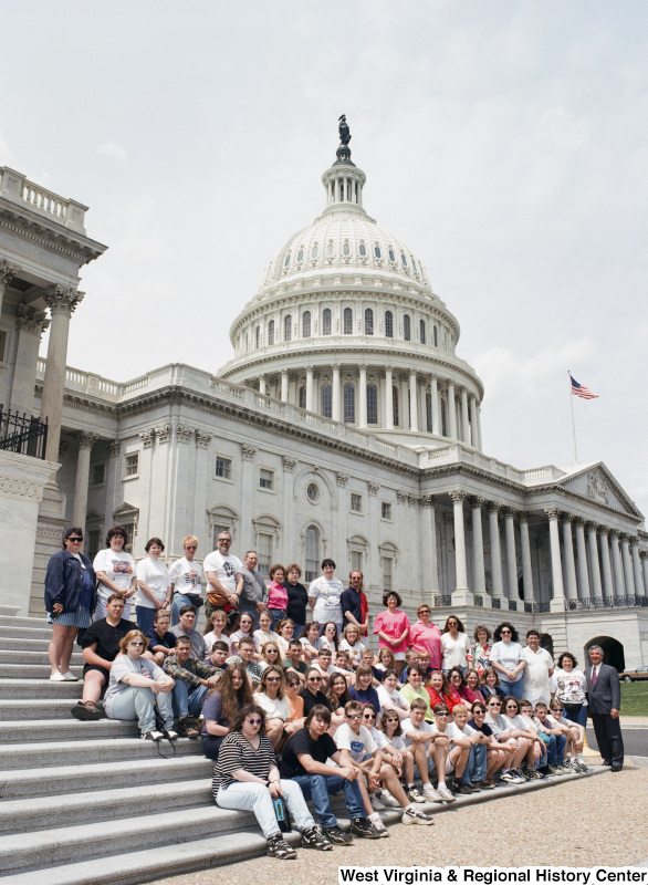 Photograph of Congressman Nick J. Rahall with a group of unidentified people outside of the Capitol