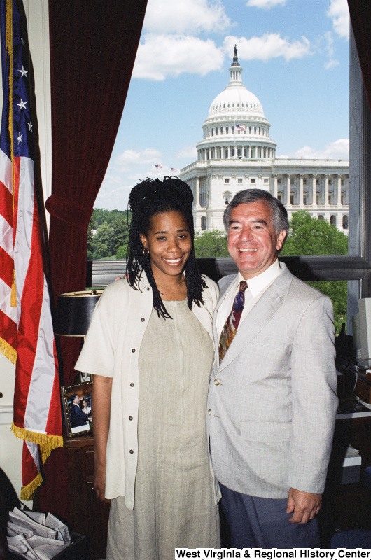 Photograph of Congressman Nick Joe Rahall posing in his office with an unidentified visitor