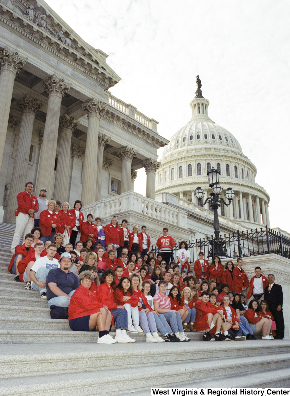 Photograph of Congressman Nick Joe Rahall with an unidentified school group posing on the steps of the Capitol