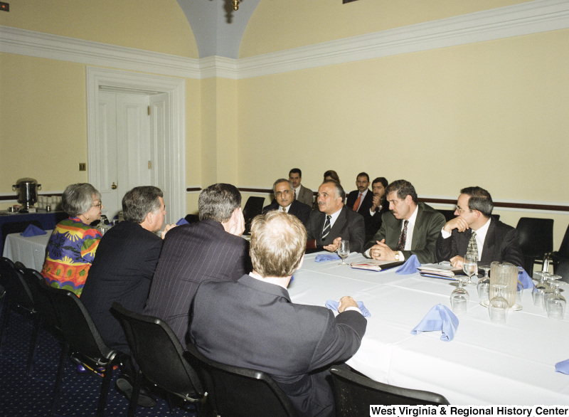 Photograph of Congressman Nick Rahall in a meeting with an unidentified group of people