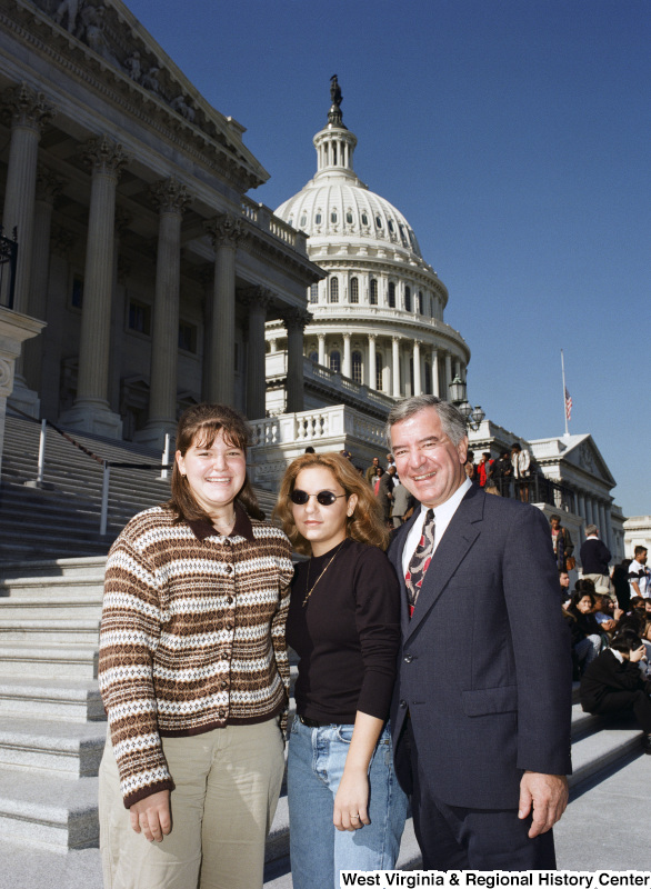 Photograph of Congressman Nick Rahall posing at the Capitol with two unidentified women