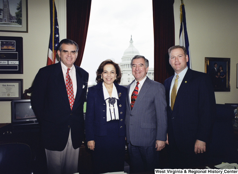 Photograph of Congressmen Nick Rahall and Ray LaHood with other unidentified people