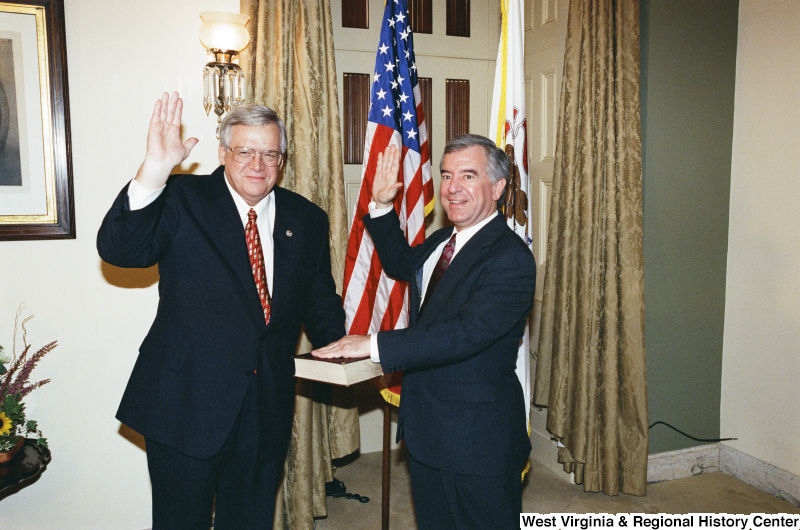 Photograph of Congressmen Nick Rahall and Dennis Hastert at a swearing-in ceremony