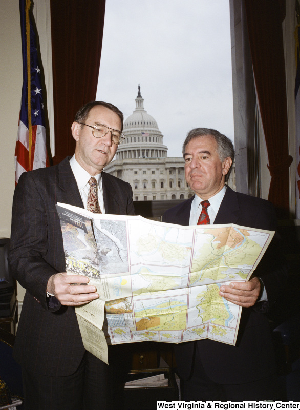 Photograph of Congressman Nick Rahall and an unidentified man looking at a map