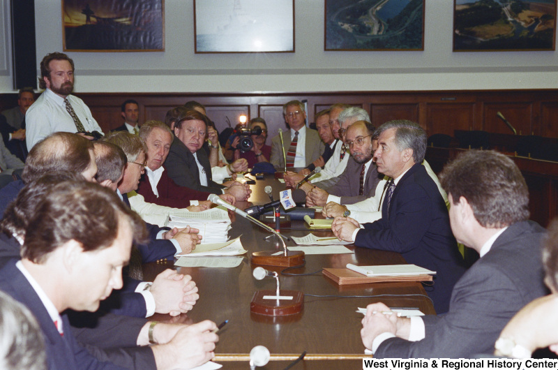 Photograph of Congressman Nick J. Rahall in a meeting with a group of unidentified people