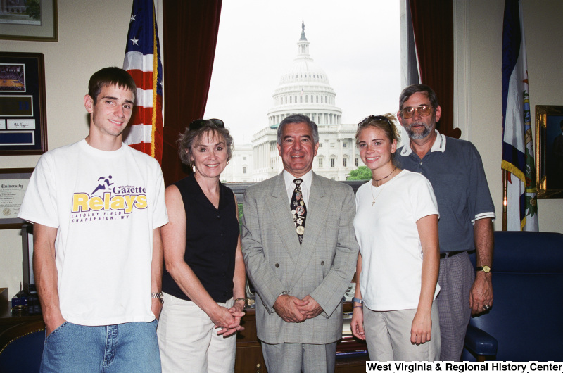 Photograph of an unidentified family visiting with Congressman Nick Rahall