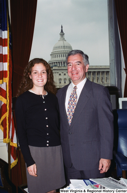 Photograph of Congressman Nick Rahall and an unidentified young lady in his Washington office