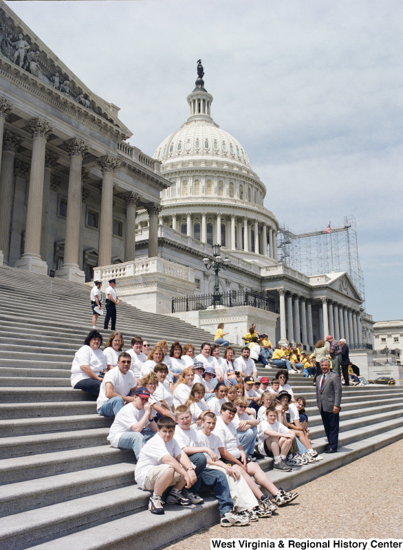 Photograph of Congressman Nick Rahall with an unidentified group on the Capitol Building steps