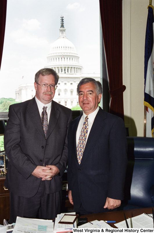 Photograph of an unidentified man visiting with Congressman Nick Rahall