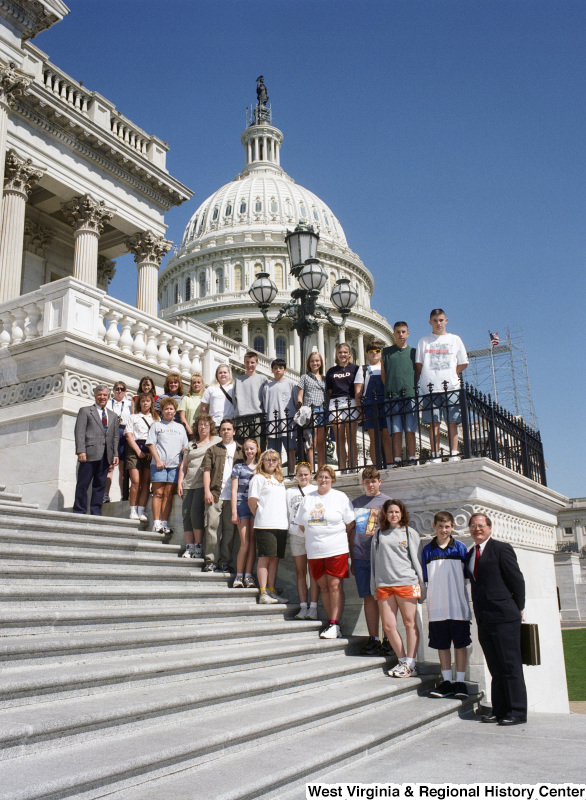 Photograph of Congressman Nick Rahall on the steps of the Capitol with a group of unidentified students