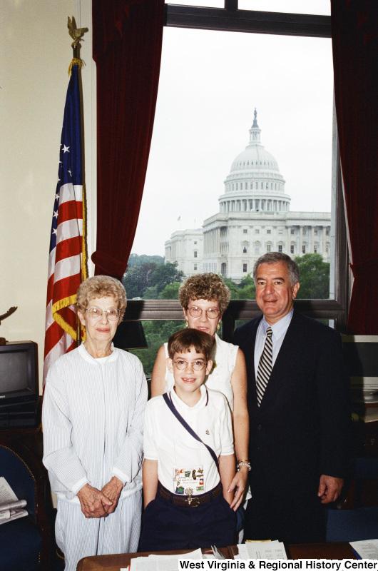 Photograph of Congressman Nick Rahall with visitor Isaac Picklesmear (sp) and family