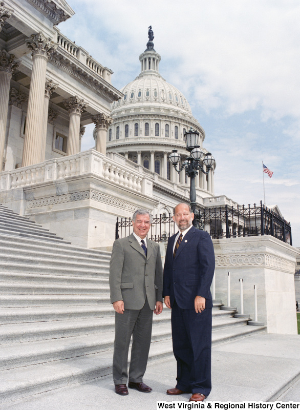 Photograph of Congressman Nick Rahall with an unidentified man posing on the steps of the Capitol Building