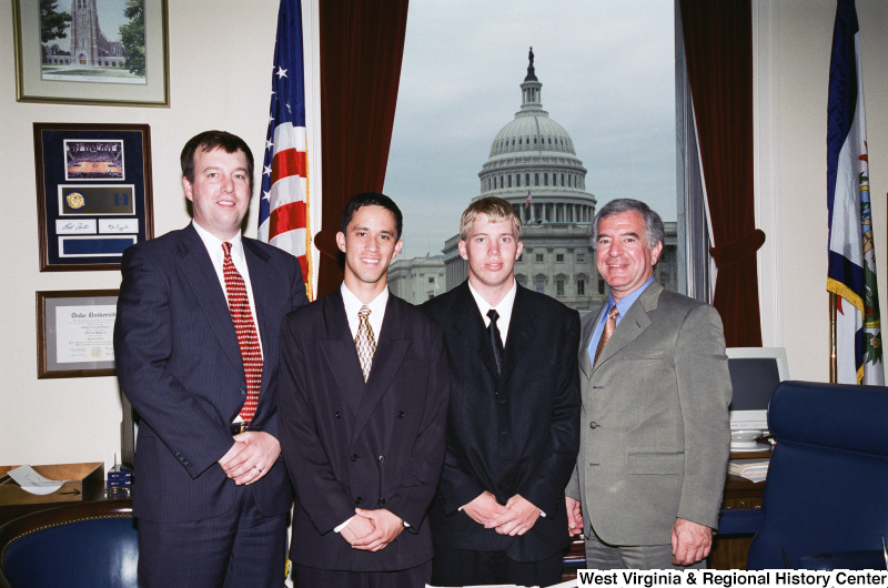 Photograph of Congressman Nick Rahall with a group of unidentified young professionals in his Washington office