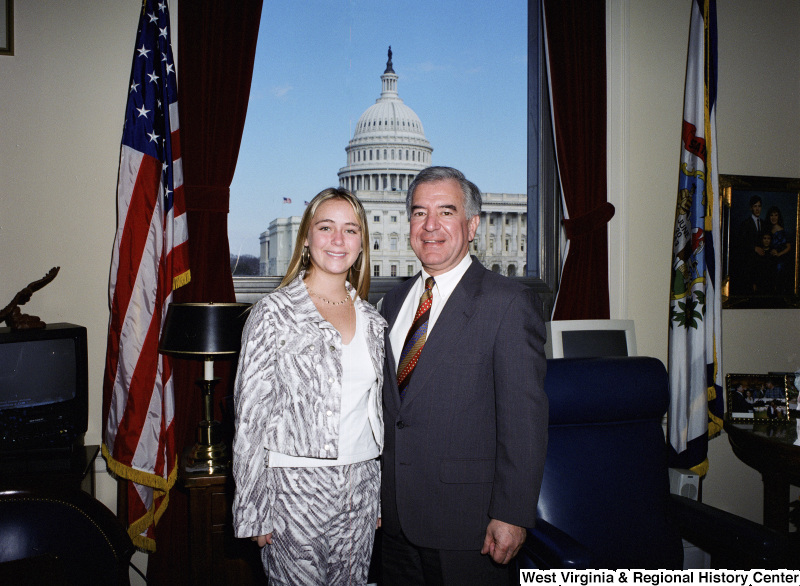 Photograph of an unidentified female visitor and Congressman Nick J. Rahall in his Washington office