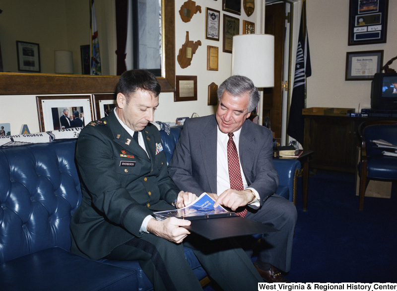 Photograph of Congressman Nick J. Rahall speaking with Military Officer Rivenburgh