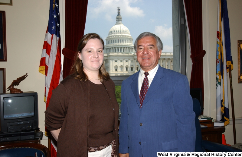 Congressman Rahall stands with an unidentified woman in his Washington office.