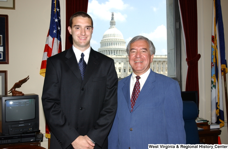 Congressman Rahall stands with a man in his Washington office.